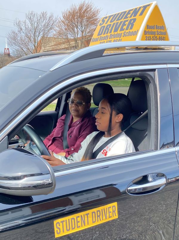 Student in school car with an instructor